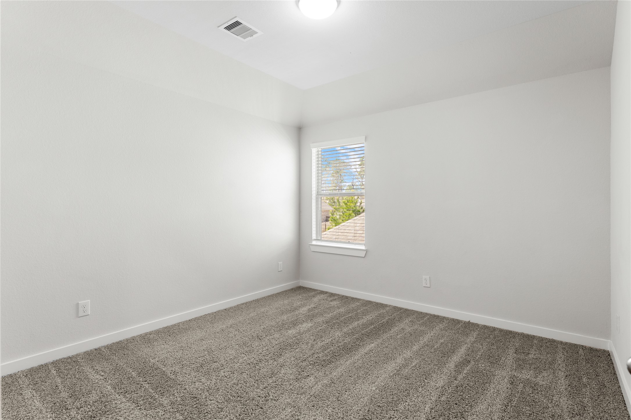 439 Flowering Lotus Court Conroe, TX 77318 - Photo 24 of 33 an empty room with windows
