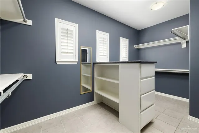 a view of an empty room with windows