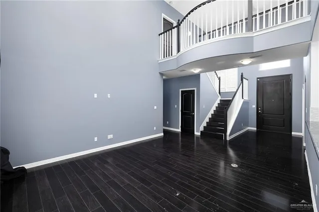 a view of an entryway with wooden floor