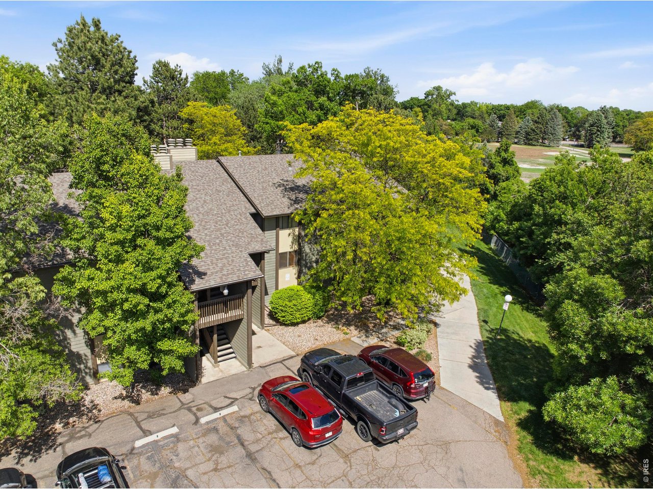 925 Columbia Road, Unit 824 Fort Collins, CO 80525 - Photo 32 of 36 an aerial view of a house with a yard