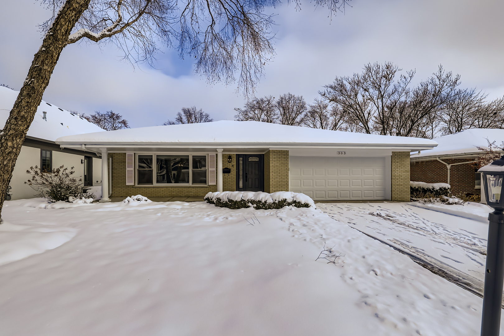 303 South Fernandez Avenue Arlington Heights, IL 60005 - Photo 1 of 1 a view of a house with backyard and sitting area
