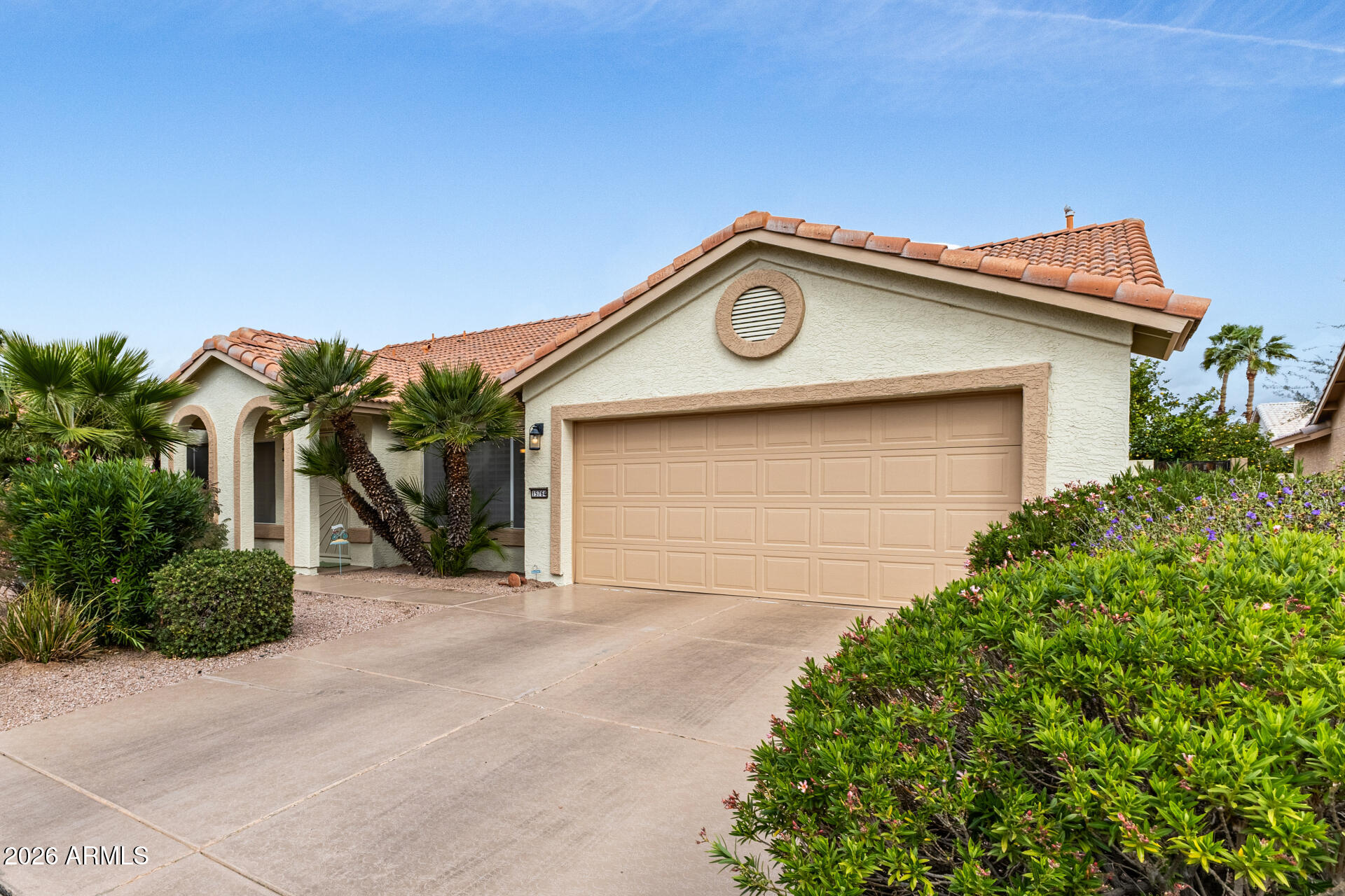 15764 Piccadilly Road Goodyear, AZ 85395 - Photo 1 of 31 a front view of a house with a garden