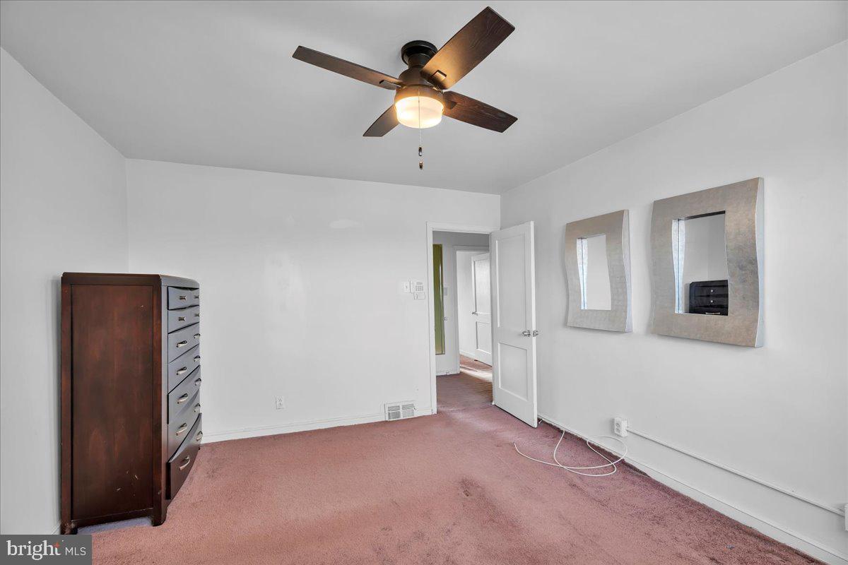 8504 Forrest Avenue Philadelphia, PA 19150 - Photo 16 of 23 a view of an empty room with a ceiling fan