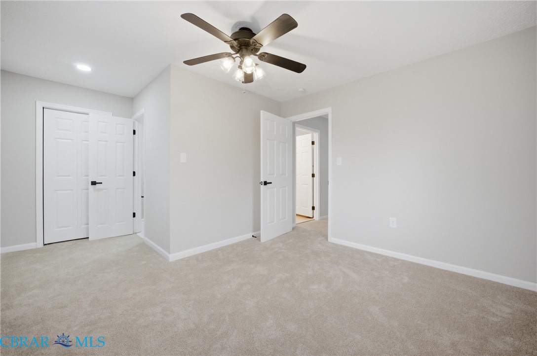 733 Spruce Street Hampton, VA 23661 - Photo 13 of 29 Unfurnished bedroom with light carpet and a ceiling fan