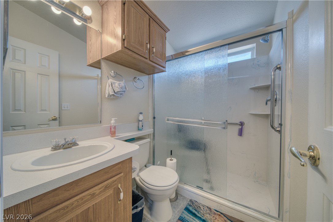 2931 Rio Rancho Drive, Unit 4 Pahrump, NV 89048 - Photo 15 of 21 Functional full bathroom featuring a convenient vanity and an accessible shower stall.