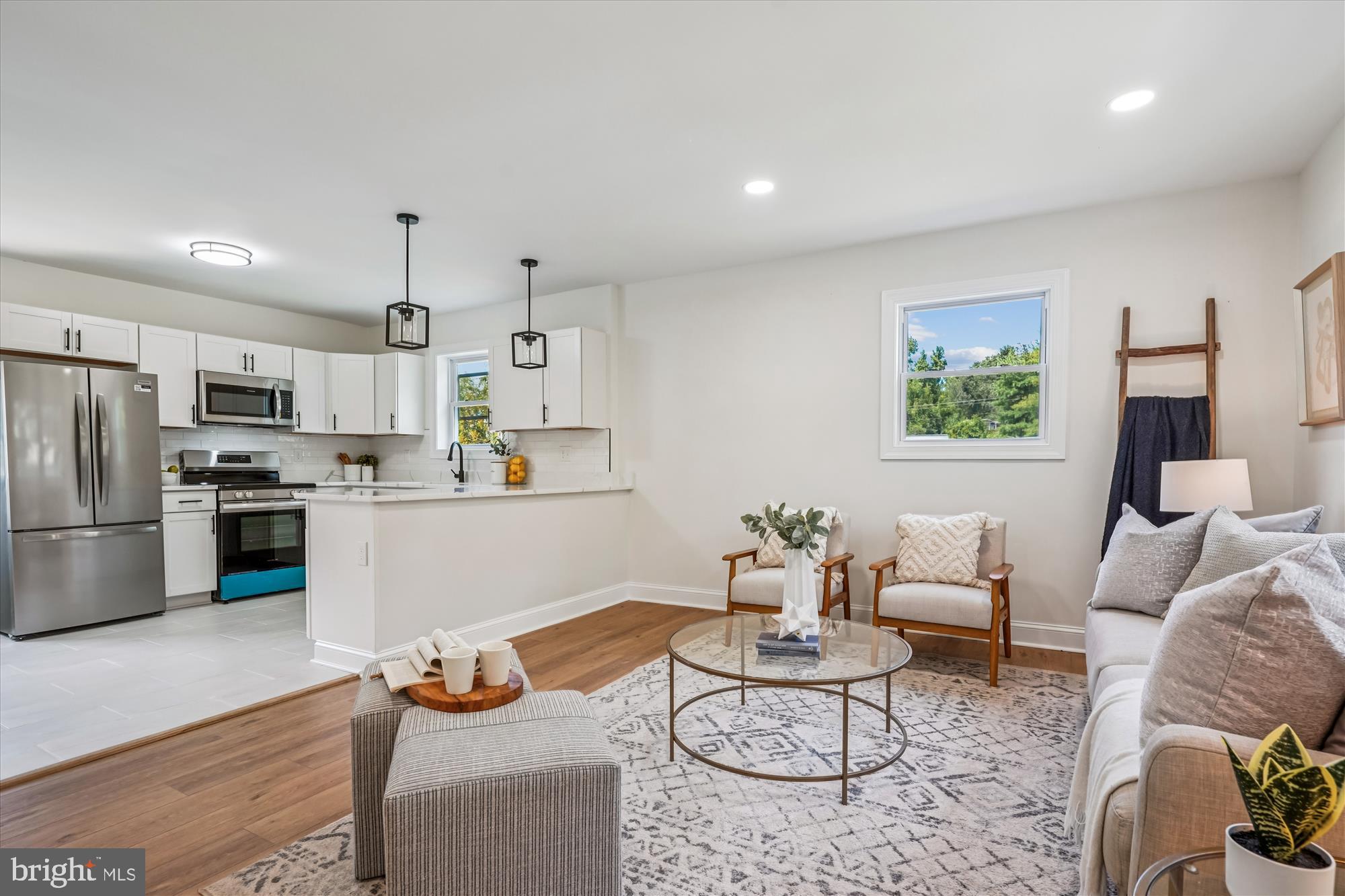 1030 Stephen Reid Drive Huntingtown, MD 20639 - Photo 5 of 30 a living room with furniture kitchen view and a refrigerator