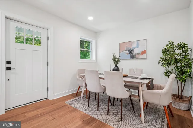a view of a livingroom with furniture and a potted plant
