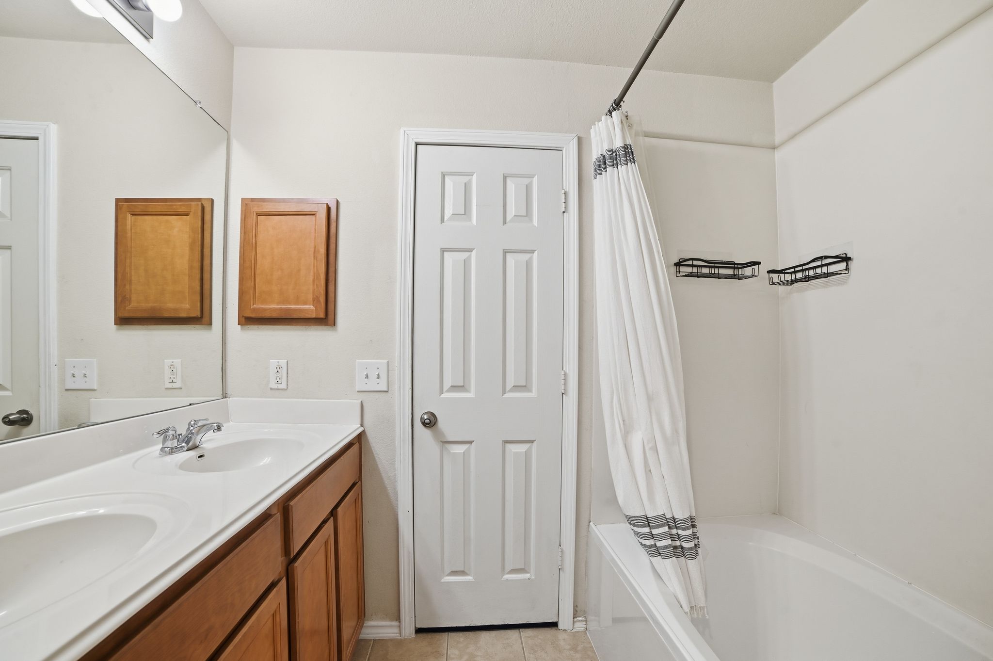 316 Housefinch Loop Leander, TX 78641 - Photo 21 of 37 a bathroom with a tub sink vanity and mirror