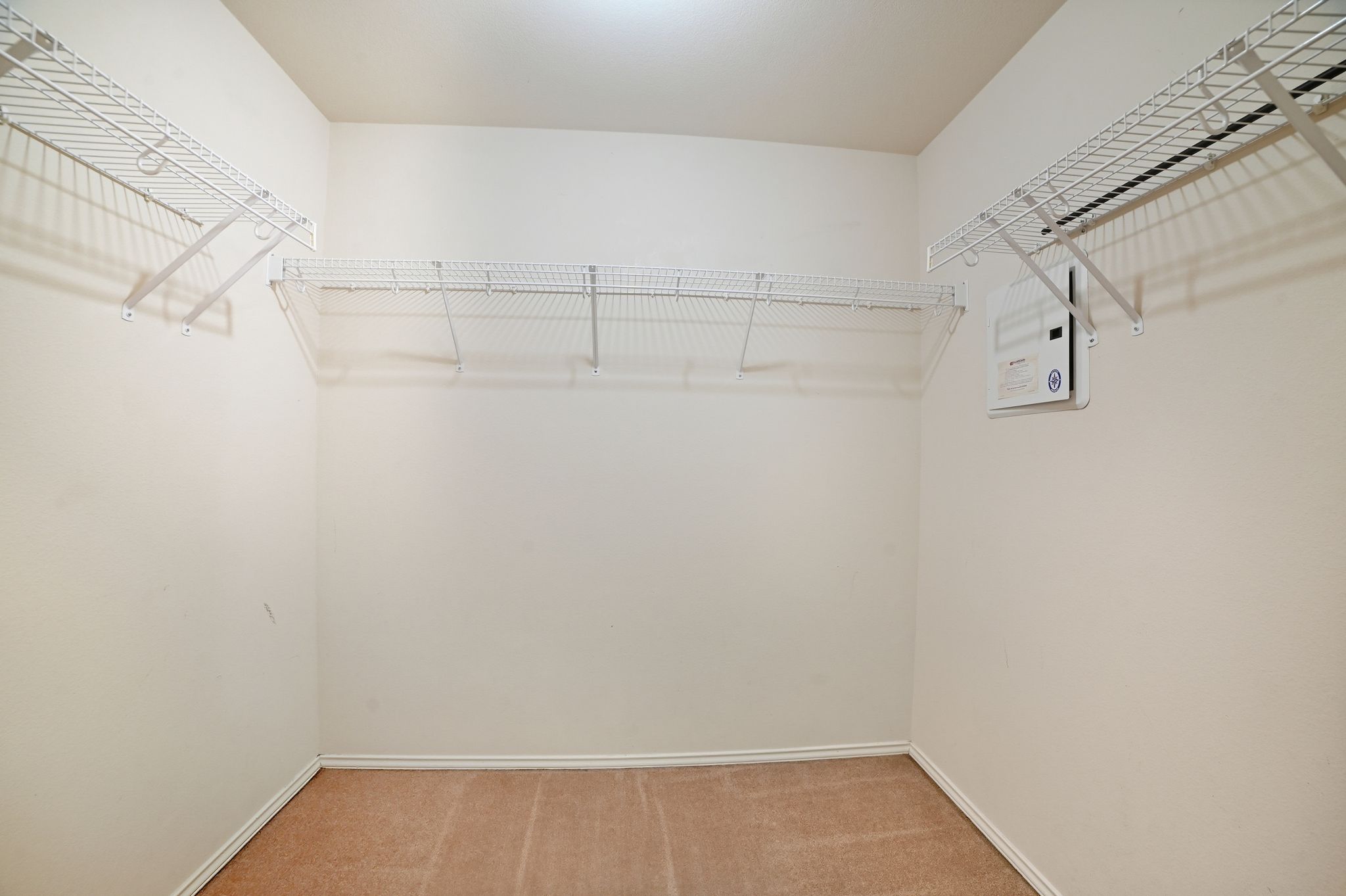 316 Housefinch Loop Leander, TX 78641 - Photo 22 of 37 a view of a room with racks on the wall