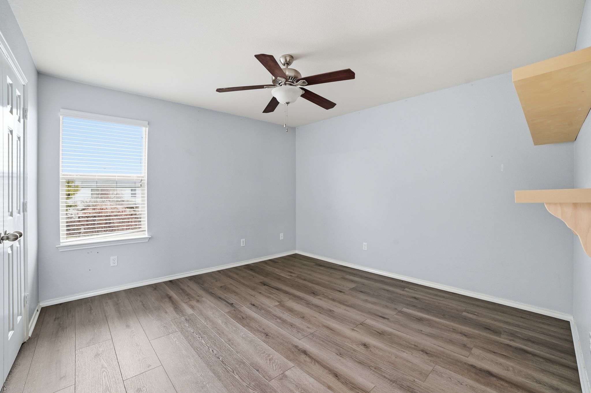 316 Housefinch Loop Leander, TX 78641 - Photo 26 of 37 wooden floor in an empty room with a window