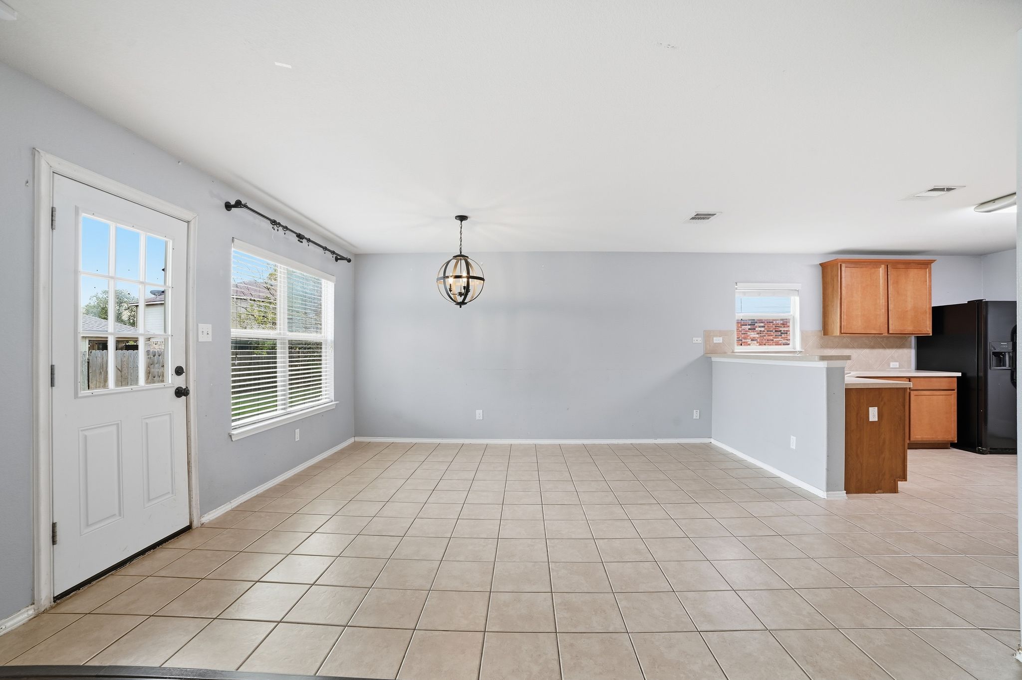 316 Housefinch Loop Leander, TX 78641 - Photo 3 of 37 a view of a kitchen with microwave and cabinets