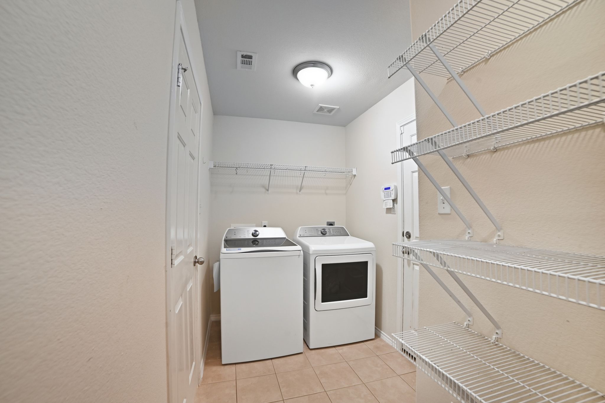 316 Housefinch Loop Leander, TX 78641 - Photo 31 of 37 a view of a storage & utility room with washer and dryer