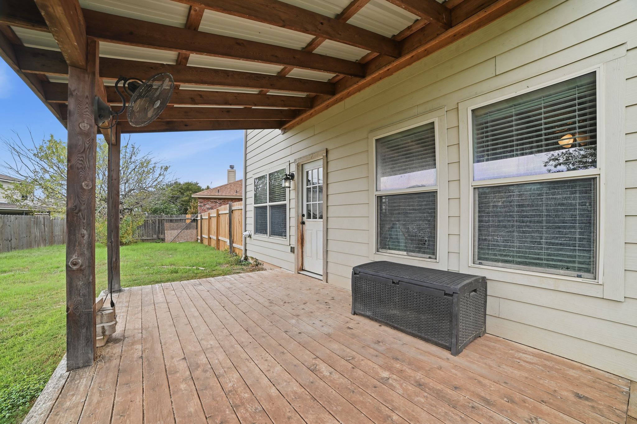 316 Housefinch Loop Leander, TX 78641 - Photo 32 of 37 a view of a porch with wooden floor and fence