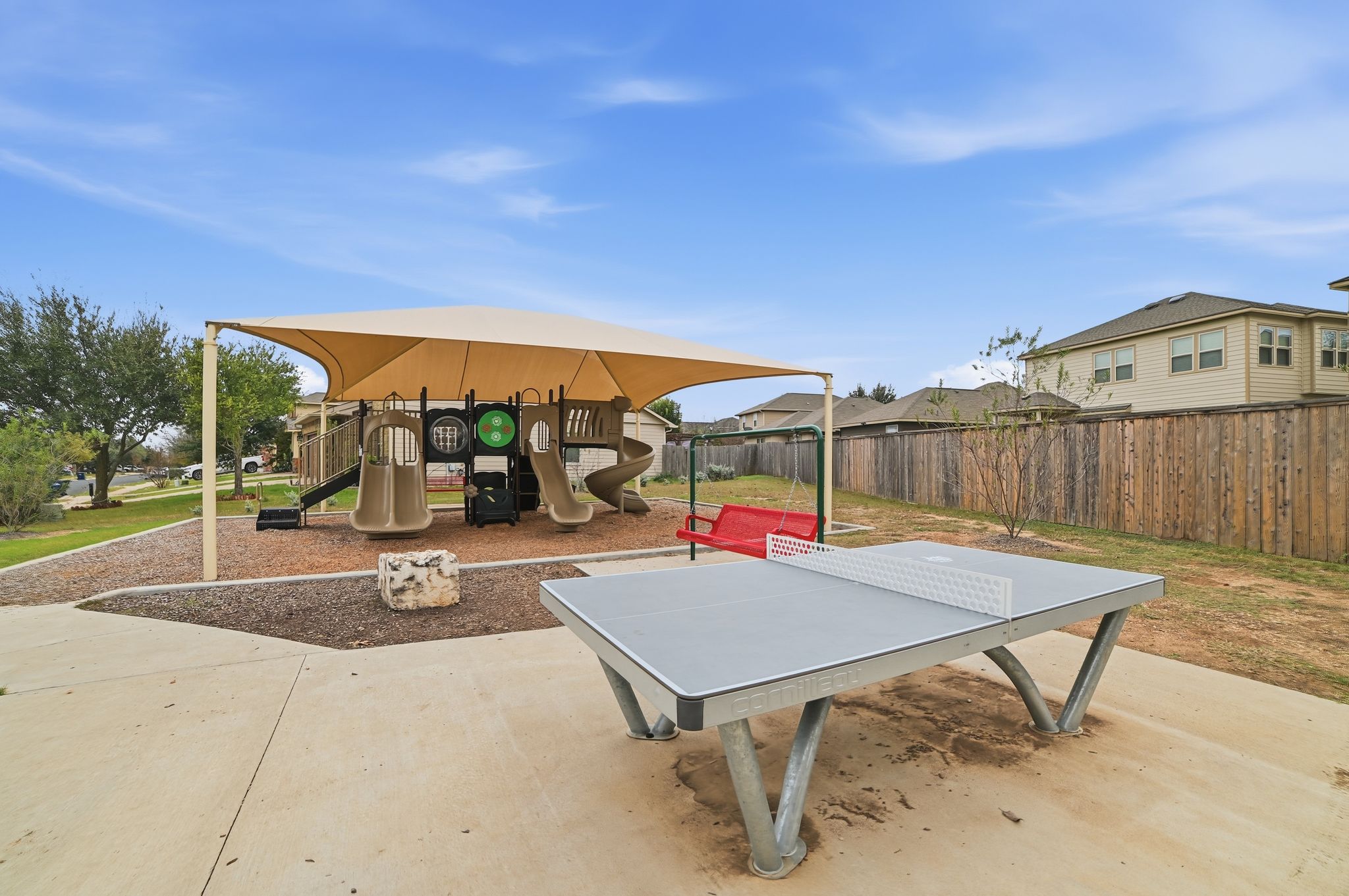 316 Housefinch Loop Leander, TX 78641 - Photo 36 of 37 a view of a backyard with sitting area