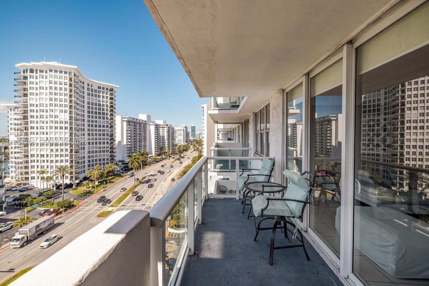 5601 Collins Avenue, Unit 1019 Miami Beach, FL 33140 - Photo 13 of 29 a view of balcony with furniture and outdoor seating