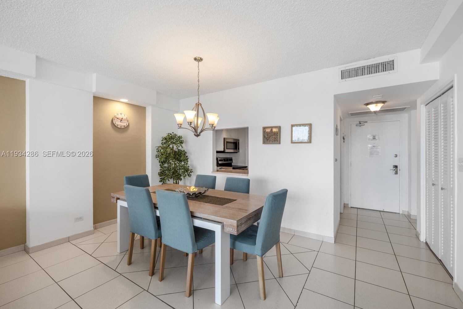 5601 Collins Avenue, Unit 1019 Miami Beach, FL 33140 - Photo 17 of 29 a view of a dining room with furniture