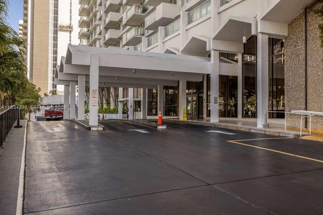 5601 Collins Avenue, Unit 1019 Miami Beach, FL 33140 - Photo 9 of 29 an outdoor view of a building with traffic signal lights