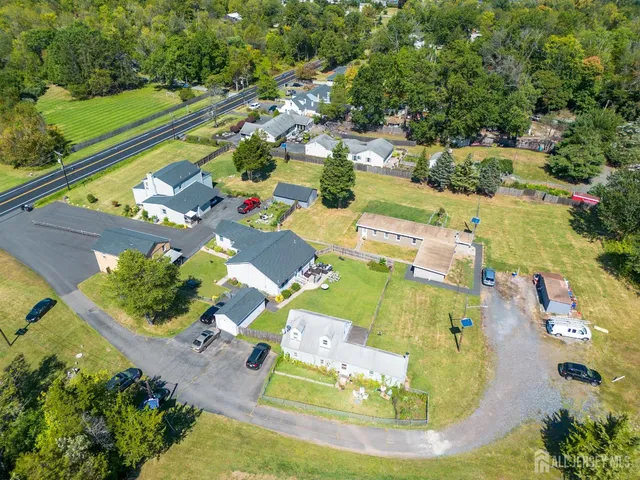 an aerial view of residential houses with outdoor space