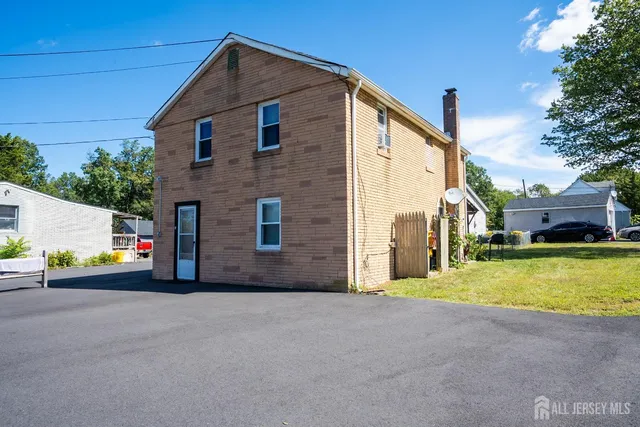 a view of a house with a street