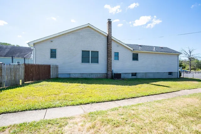 a house view with a backyard space