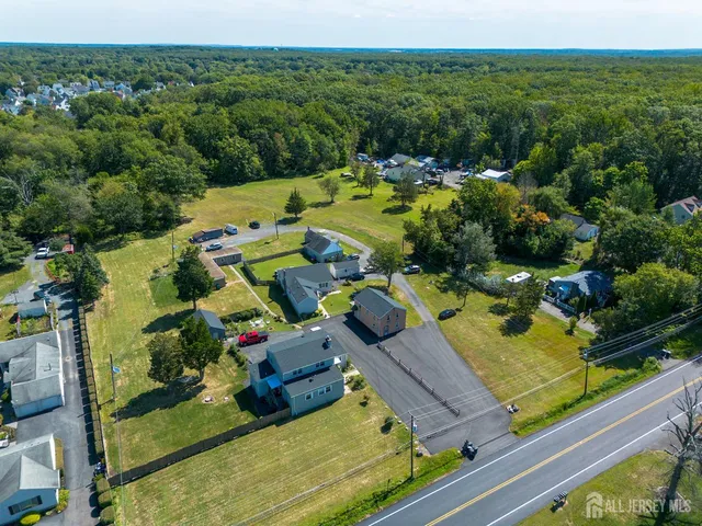 an aerial view of a house with a garden