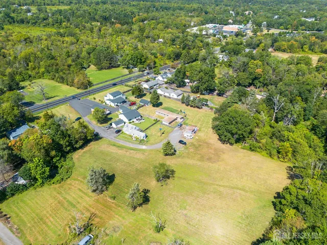 a view of a swimming pool and trees