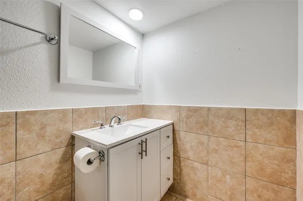 a bathroom with a sink and vanity