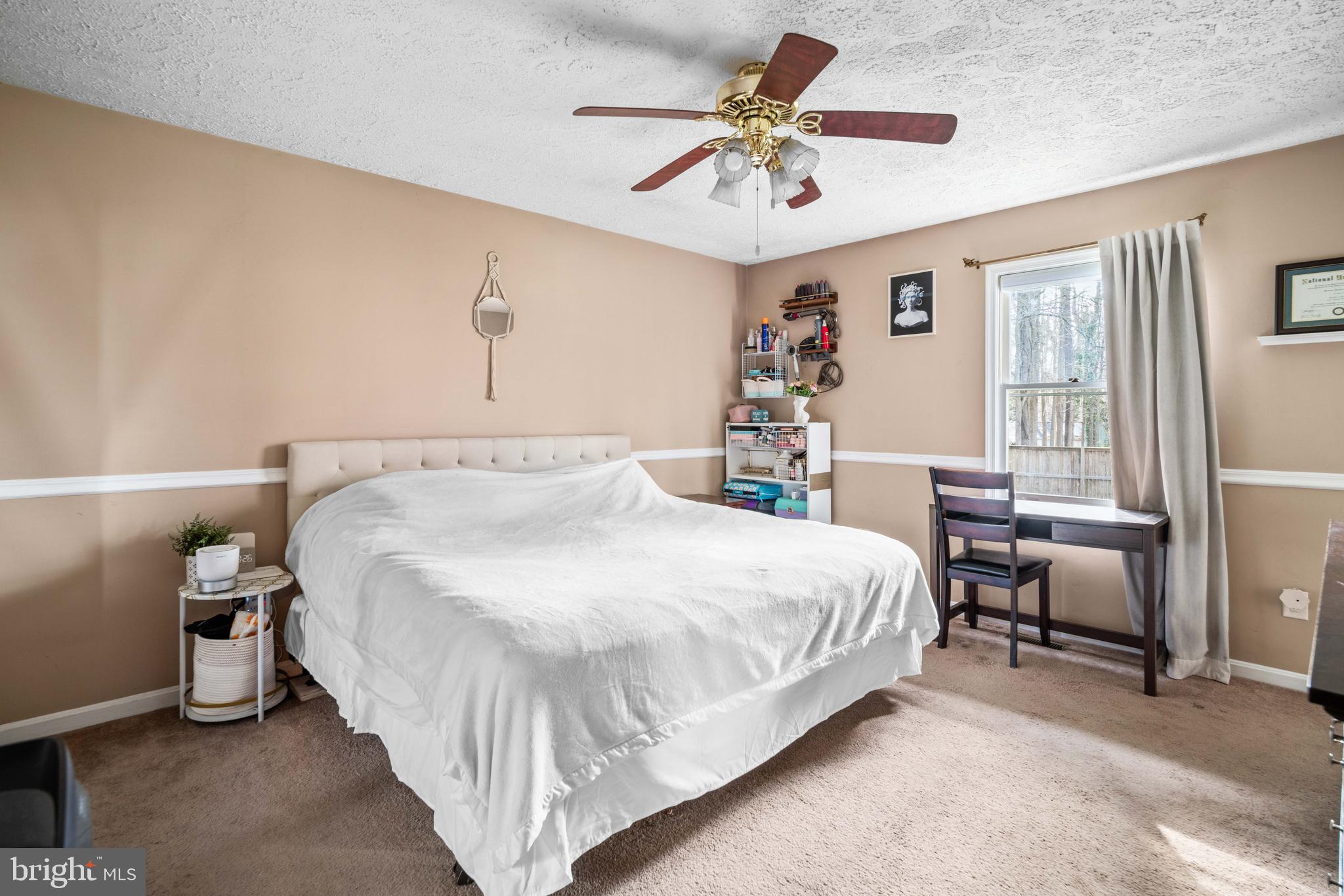 11543 San Rafael Road Lusby, MD 20657 - Photo 12 of 20 a bedroom with a bed and a chandelier
