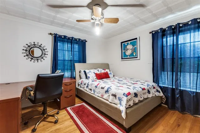 a bedroom with a bed and a chair