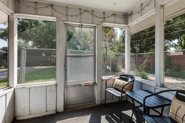 a room with a potted plant on the wall