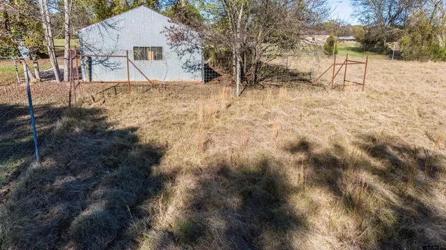 a view of a yard covered in snow