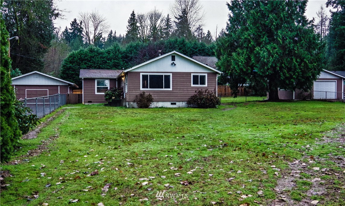 22028 9th Avenue Southeast Bothell, WA 98021 - Photo 1 of 16 a front of a house with a yard