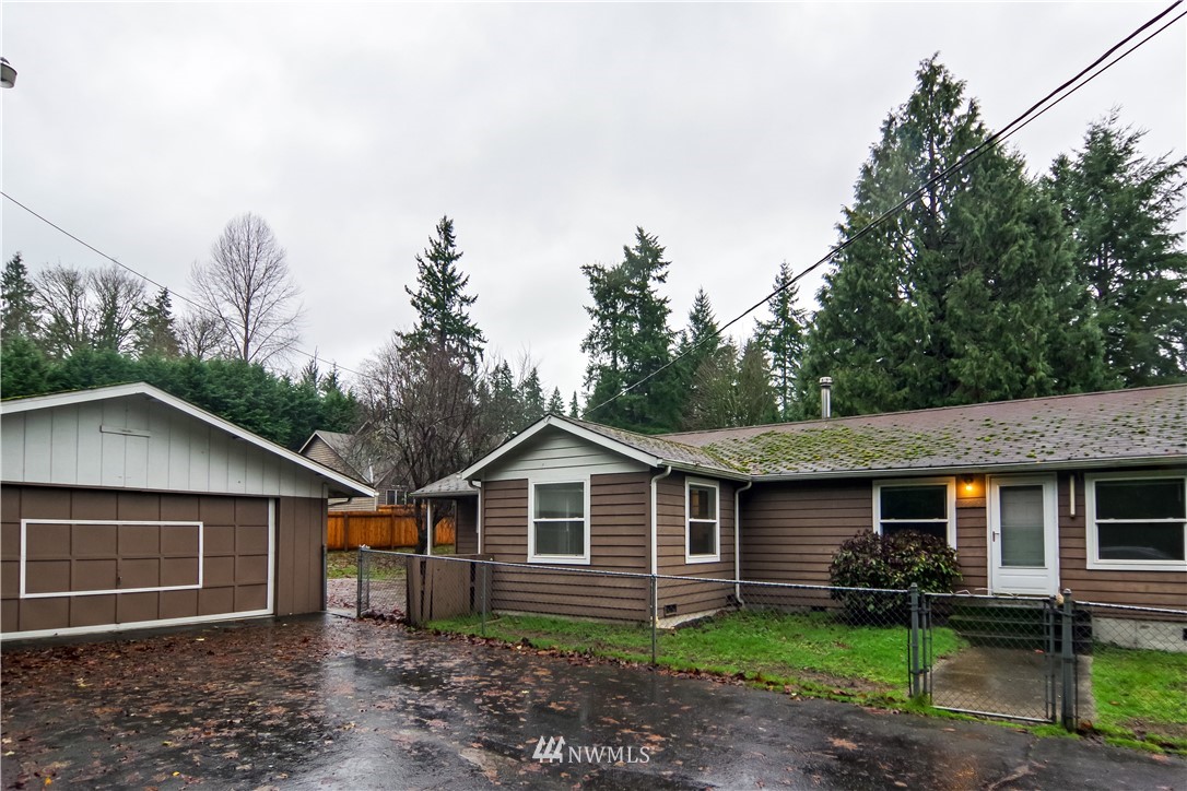 22028 9th Avenue Southeast Bothell, WA 98021 - Photo 2 of 16 a front view of a house with garden