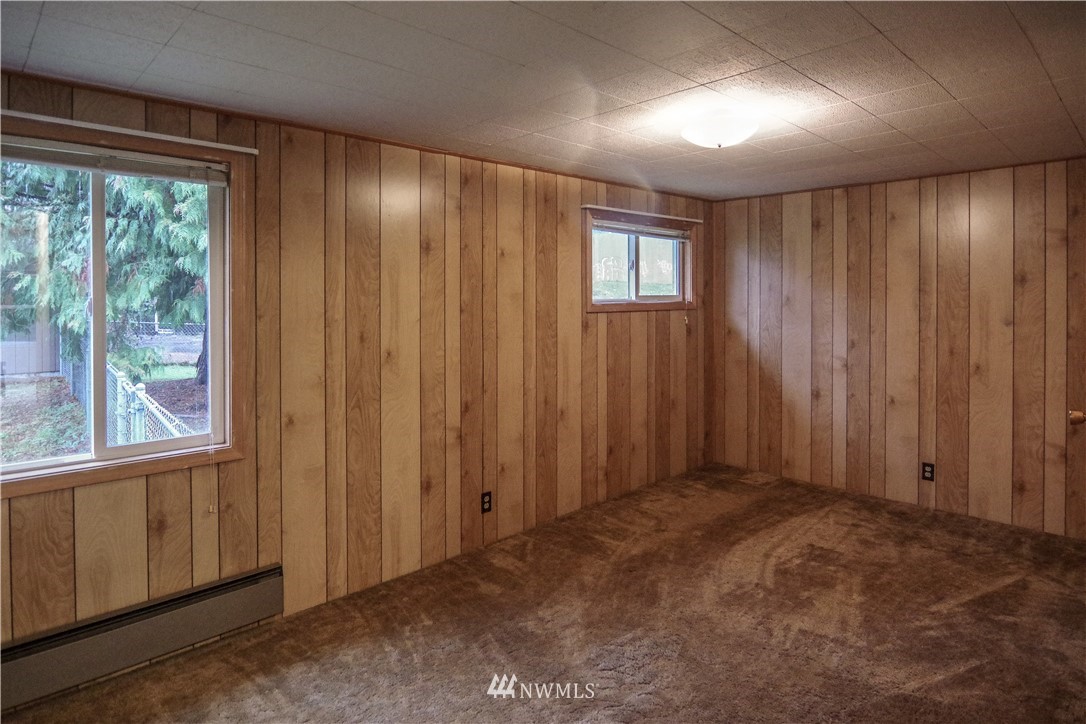 22028 9th Avenue Southeast Bothell, WA 98021 - Photo 7 of 16 a view of an empty room with a window
