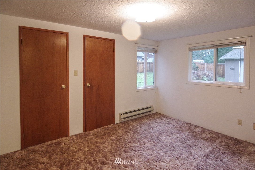 22028 9th Avenue Southeast Bothell, WA 98021 - Photo 8 of 16 a view of an empty room with window and closet area