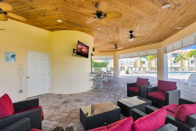 a outdoor space with lots of furniture and wooden floor