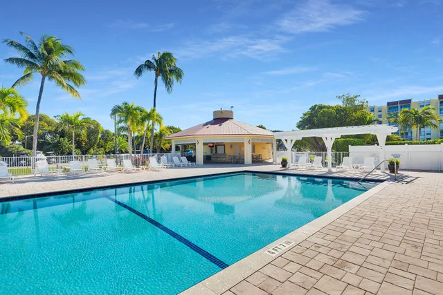a view of a swimming pool with a lounge chairs