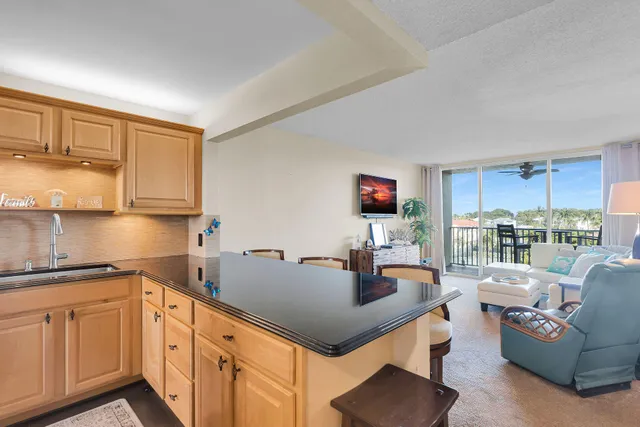 a kitchen with stainless steel appliances granite countertop a sink and cabinets