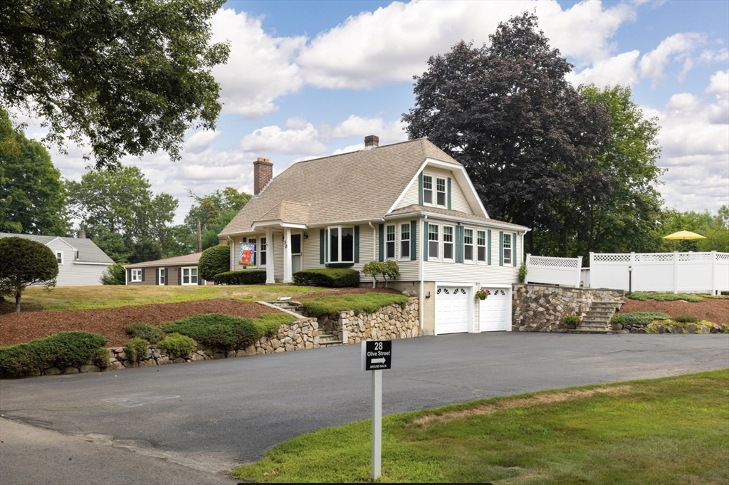 30 Olive Street Ashland, MA 01721 - Photo 1 of 9 a front view of a house with a yard street and trees
