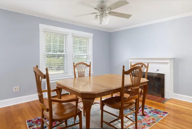 a dining room with furniture and wooden floor