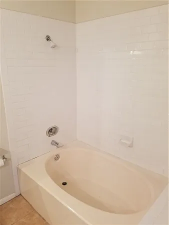 a white bath tub sitting in a bathroom