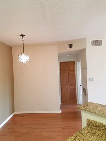 a view of a livingroom with wooden floor