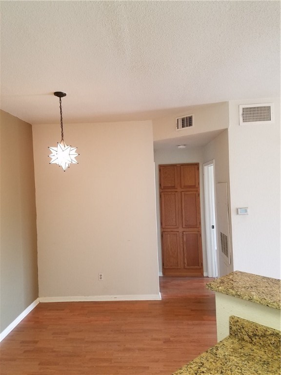 2450 Wickersham Lane, Unit 1317 Austin, TX 78741 - Photo 8 of 20 a view of a livingroom with wooden floor