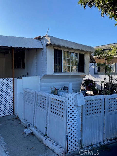 2767 West 1st Street, Unit 26 Santa Ana, CA 92703 - Photo 3 of 15 a kitchen view with granite countertop a stove a cabinets and a sink