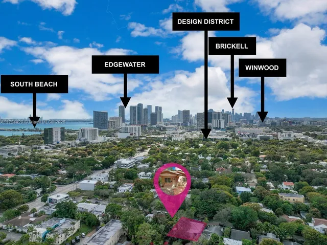 an aerial view of a house with a yard and garden