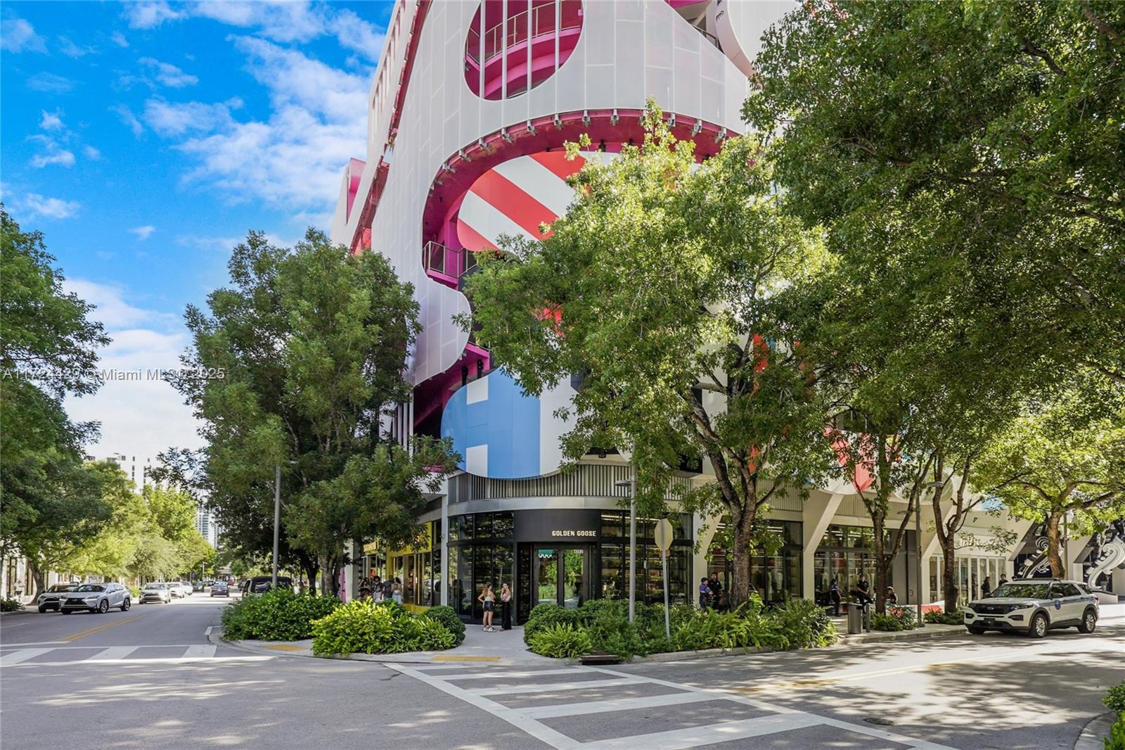 133 Northeast 48th Street Miami, FL 33137 - Photo 22 of 32 a front view of a building with street sign and trees
