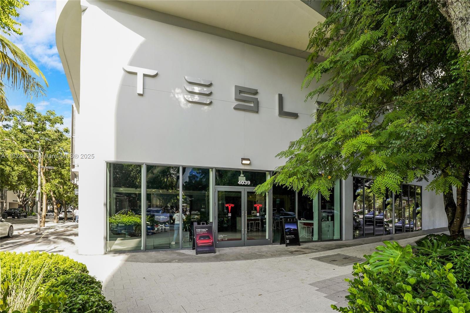 133 Northeast 48th Street Miami, FL 33137 - Photo 25 of 32 a view of a brick house with a large windows and large tree