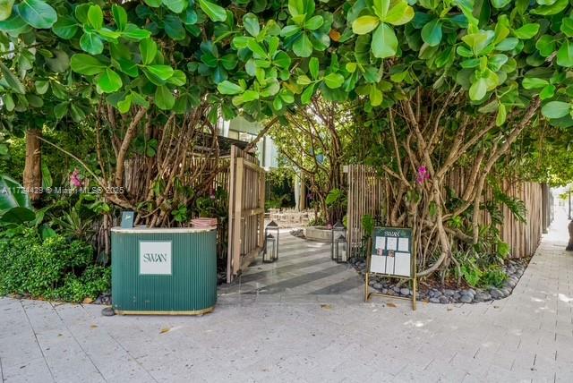 133 Northeast 48th Street Miami, FL 33137 - Photo 32 of 32 a backyard of a house with table and chairs