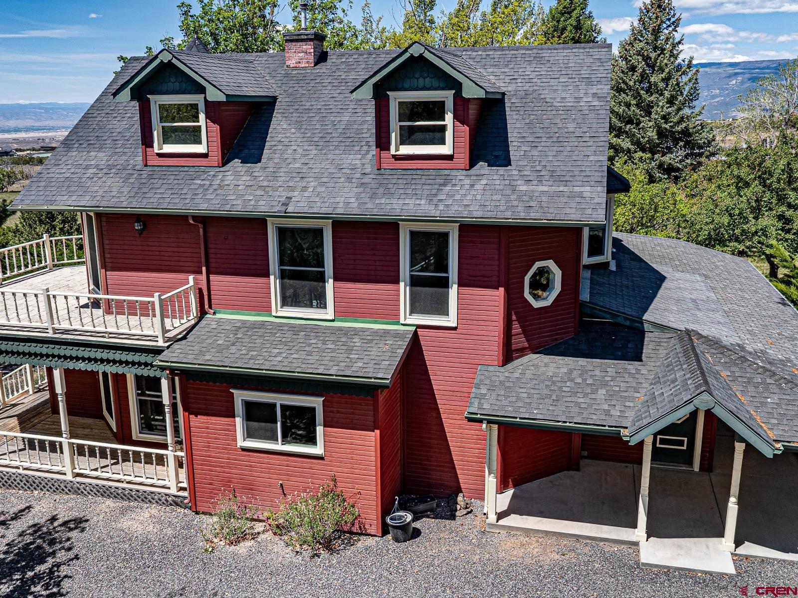16331 2550th Road Cedaredge, CO 81413 - Photo 4 of 45 a front view of a house with garden