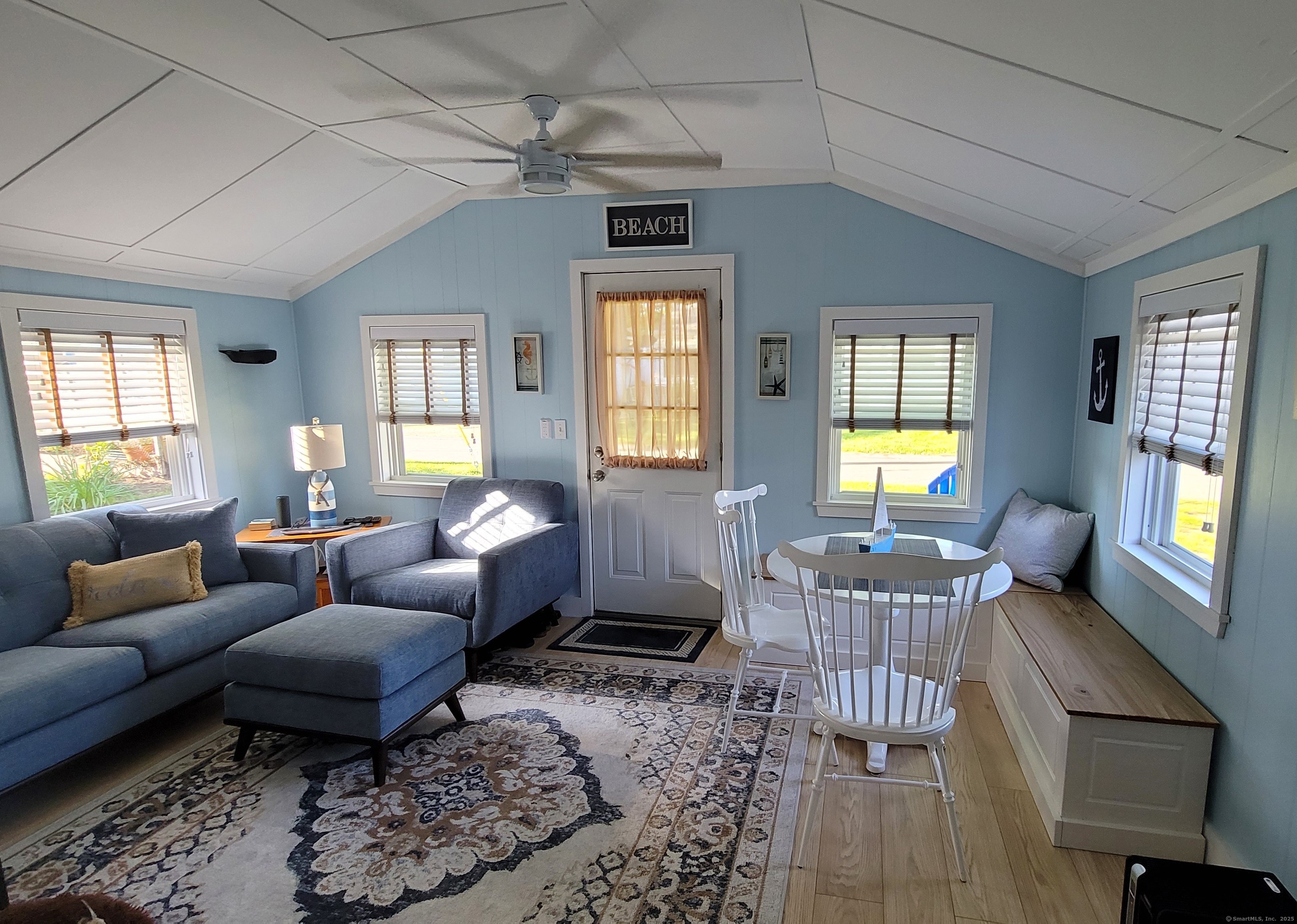 a living room with furniture and a window